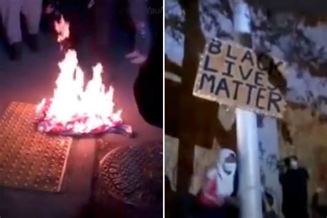 Portland protesters burn an American flag hanging outside the Justice ...