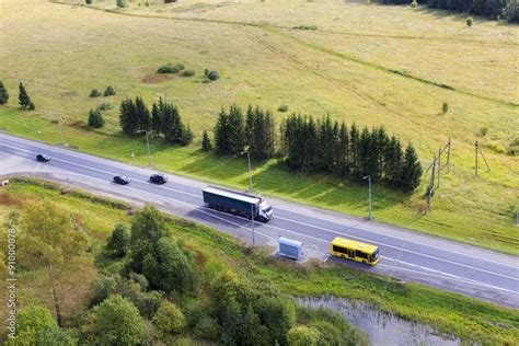 highway top view. highway with cars, trucks and buses passes through ...