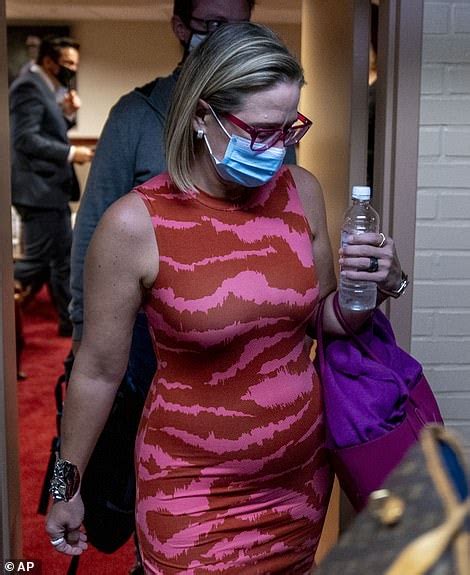 Call the fashion police! As Arizona Senator Kyrsten Sinema is brutally mocked over garish yellow ...