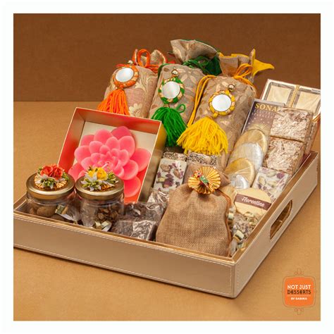 This leather tray gives your hamper a classy look. You can fill this fully customizable hamper ...