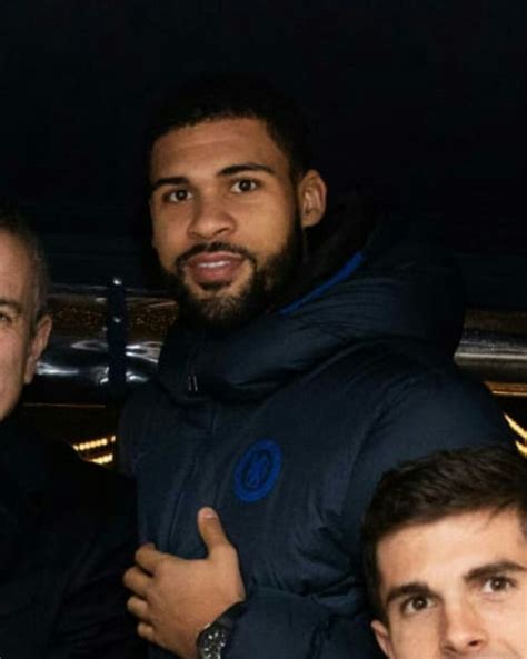 three men posing for a photo in the dark