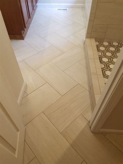 12x24 master bath floor on a diagonal herringbone | Bathroom floor tiles, Herringbone tile ...