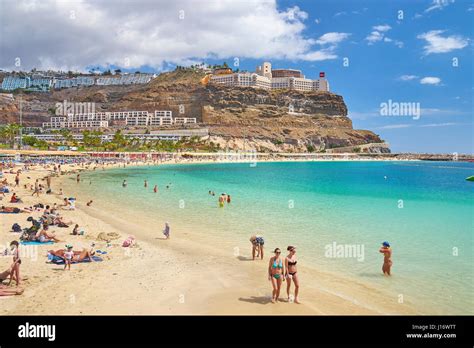 Tourists on the Puerto Rico Beach, Gran Canaria, Spain Stock Photo - Alamy