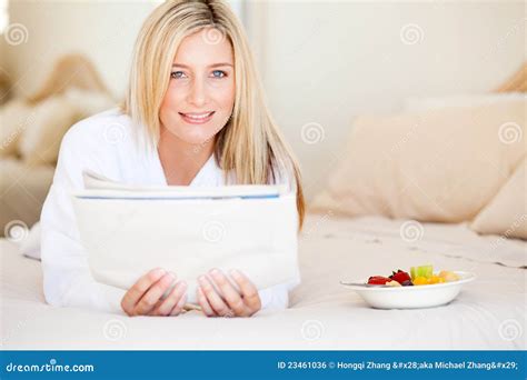 Woman reading on bed stock photo. Image of healthy, bathrobe - 23461036