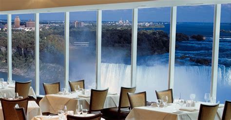 a restaurant with large windows overlooking the falls