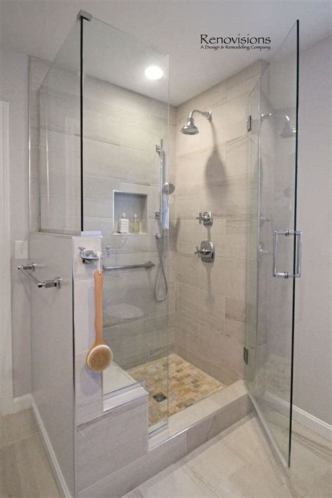 A completed Master Bathroom remodel by Renovisions. Walk-in Shower, shower seat, shower cubby ...