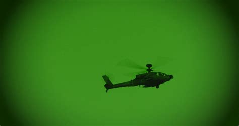 Night vision footage of AH-64 Apache attack helicopter during a combat ...