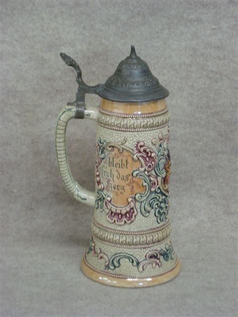 Three 1/2 liter German Beer Steins with pewter lids, one signed D.R.G.M ...