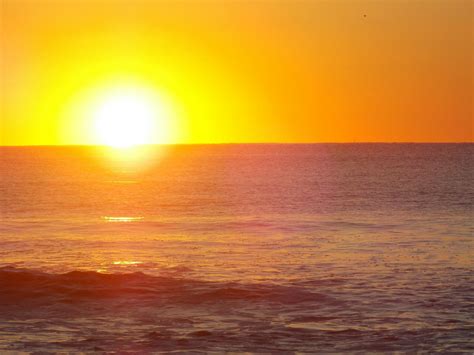 Free stock photo of sun rising on the beach