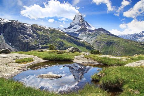 The beautiful mountain landscape with Stellisee lake. Switzerland. | Downbrook Outfits