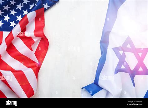 Israel USA flags. Two American and Israeli flags lie on white old ...