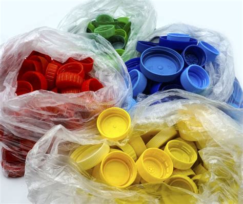 Red Plastic Bottle Caps Sorted by Colors in Transparent Single Use Plastic Bags. PP an PET ...