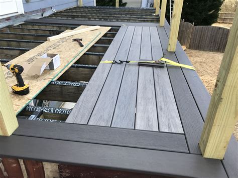 Installing Timbertech Legacy composite deck boards in espresso and ash ...