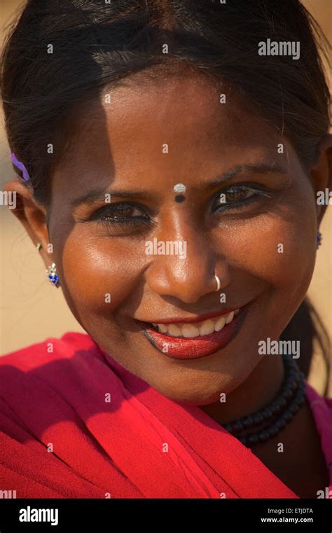 Portrait of a Rajasthani woman in red sari. Pushkar, Rajasthan, India ...