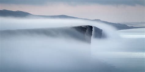 Coastal Fog | Morning fog rolling around the cliffs and into… | Flickr