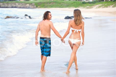 Happy Couple On Beach In Hawaii Stock Photo | Royalty-Free | FreeImages