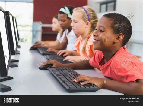 School kids using computer in classroom at school Stock Photo & Stock Images | Bigstock