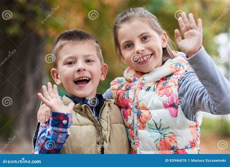 Cute Little Kids Waving Hello in the Park Stock Photo - Image of park ...