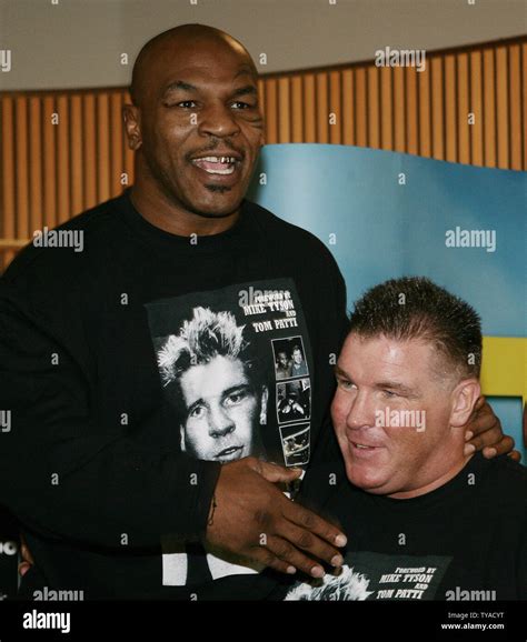 American boxer Mike Tyson (L) attends the book signing for fellow boxer Big Joe Egan (R) in ...