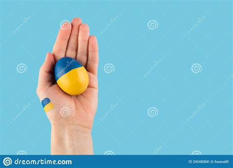 Easter Egg in Woman Hand on Ukraine Flag Colors As Concept for War Ukraine Stock Image - Image ...