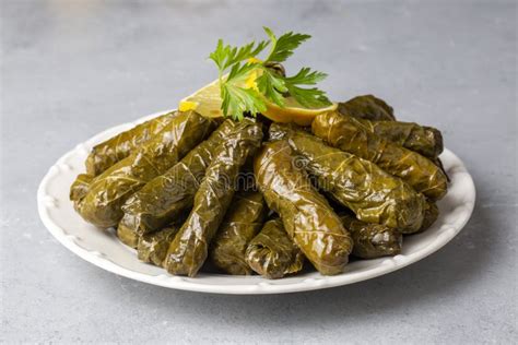 Delicious Dolma Sarma Stuffed Grape Leaves Rice, White Yogurt Sauce. Lebanese Dolma Sarma on ...