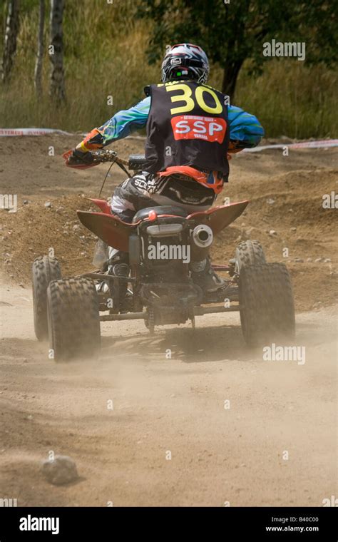 Quad rider during off road race Stock Photo - Alamy