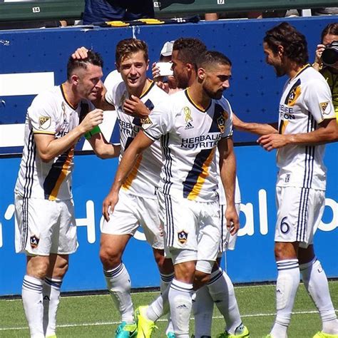 the soccer players are congratulating each other on their team's first goal