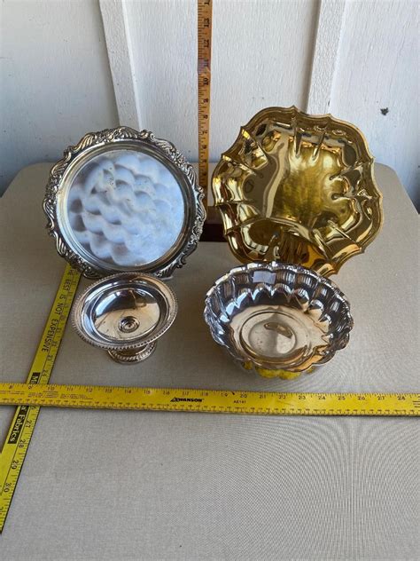 Assortment of silver plated platters and bowls | EstateSales.org