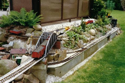 My Grandfather's LGB garden layout, photo #6. A long freight train makes its way into the new ...