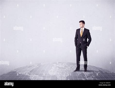 Businessman standing on world map hi-res stock photography and images - Alamy