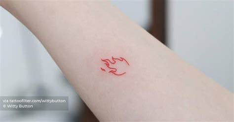 Minimalistic red flame tattoo located on the inner