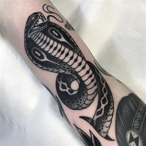 Pin by Loveandahug on Tattoo in 2021 | Cobra tattoo, Traditional snake tattoo, Skin tear tattoo