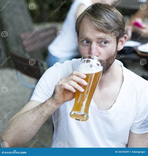 Man drinking beer stock image. Image of cheerful, glass - 26618339