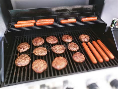 Burgers And Hot Dogs On The Grill Stock Image - Image: 54603557