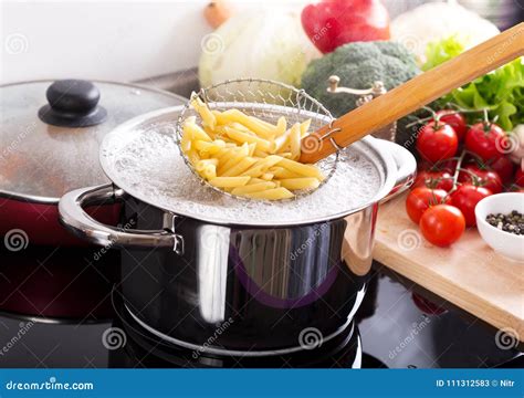 Cooking Pasta in a Pot with Boiling Water on a Cooker Stock Image - Image of kitchenware, pepper ...