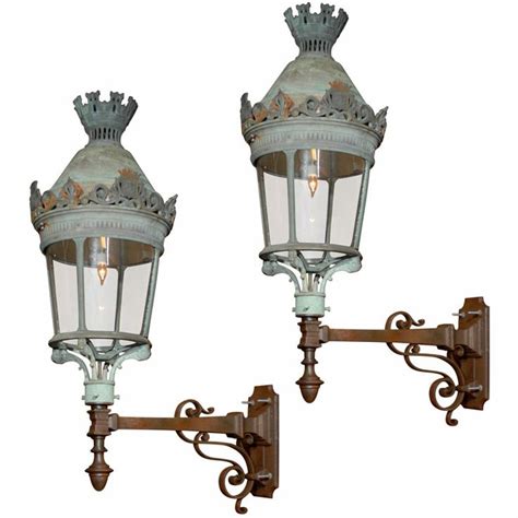 Pair of French Lanterns Mounted on Cast Iron Brackets | Modern lanterns, Lanterns, Cast iron ...
