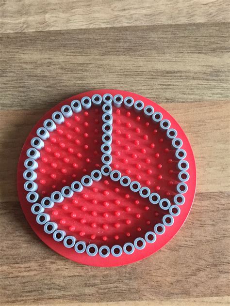 the peace sign is made out of beads