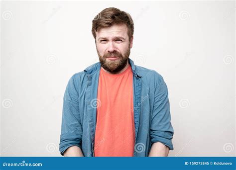 Funny Facial Expression of a Resentful Man Who is about To Cry, on a White Background. Negative ...