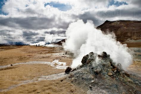 Iceland, Namafjall, fumarole releasing steam and sulfur gas - Stock Photo - Dissolve