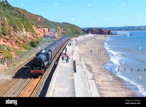 Steam locomotive 44871 'Black Five' hauling The Royal Duchy train past the sea wall Dawlish ...