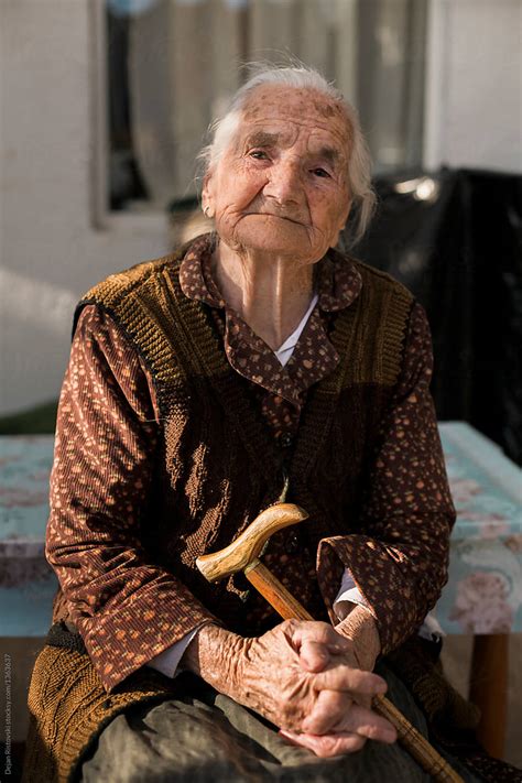 Portrait Of Old Lady With Walking Stick. by Dejan Ristovski