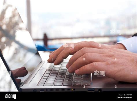 Hands typing on laptop computer Stock Photo - Alamy