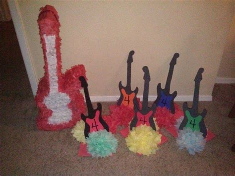 Rockstar birthday party... Table centerpieces and guitar shaped piñata ...