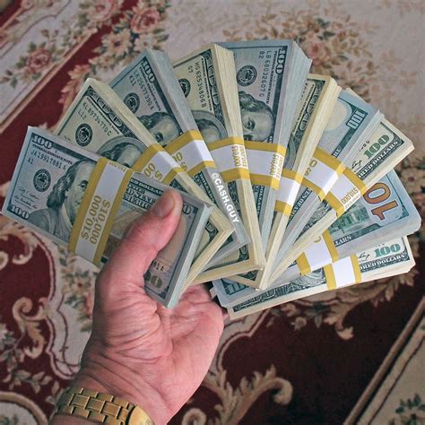 Money stacks in my hand! $100 dollar bills stacks - real inspirational power! Cash and watches ...