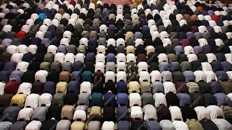 Premium Photo | A group of muslims are praying in congregation with prostrating movements in the ...