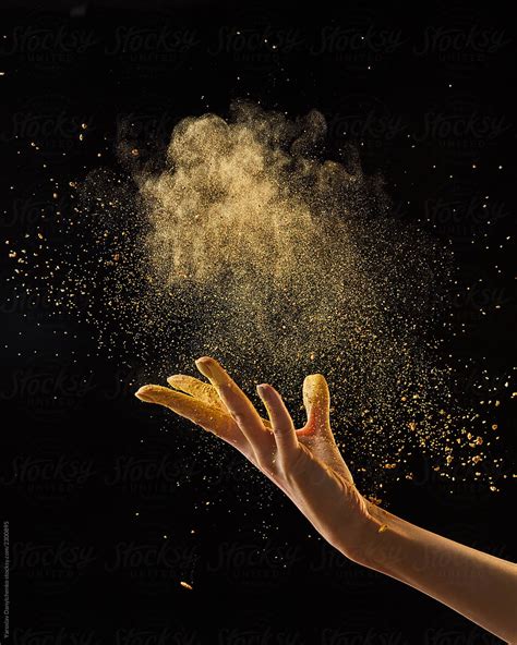 "Beautiful Photo Of Female Hand Throwing Gold Dust On A Black Background With Copy Space. Layout ...