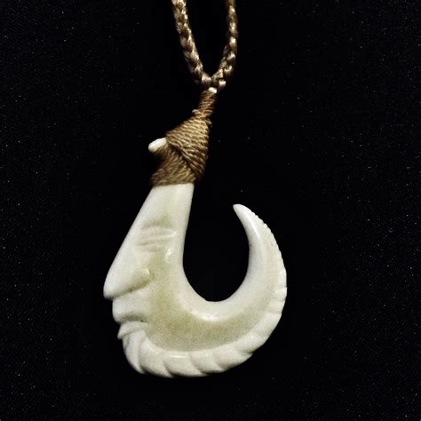 Bone hook necklace | Hand carved jewelry, Pendant designs, Bone carving