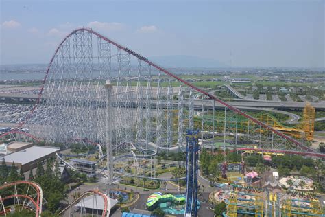 an aerial view of a roller coaster at a theme park