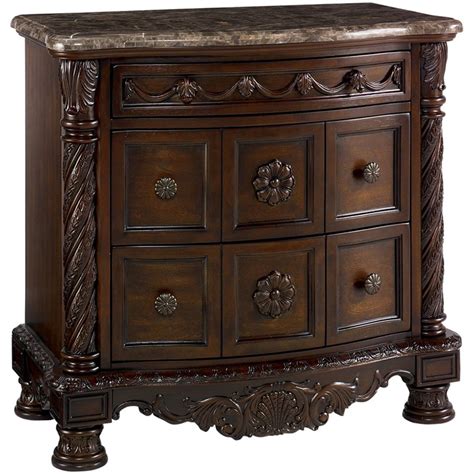 Ashley Furniture North Shore 3 Drawer Marble Top Nightstand in Brown