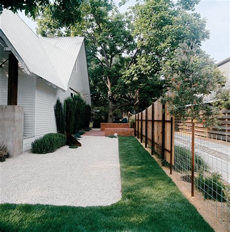 Outdoor, Walkways, and Grass Patches of sod amid white gravel keep ...